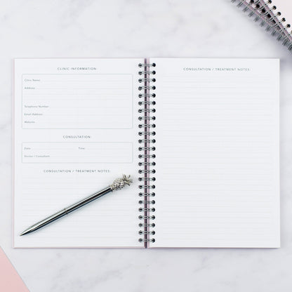 An inside spread of the Nothing But Lovely IVF Journal showing the clinic information and consultation treatment notes pages.