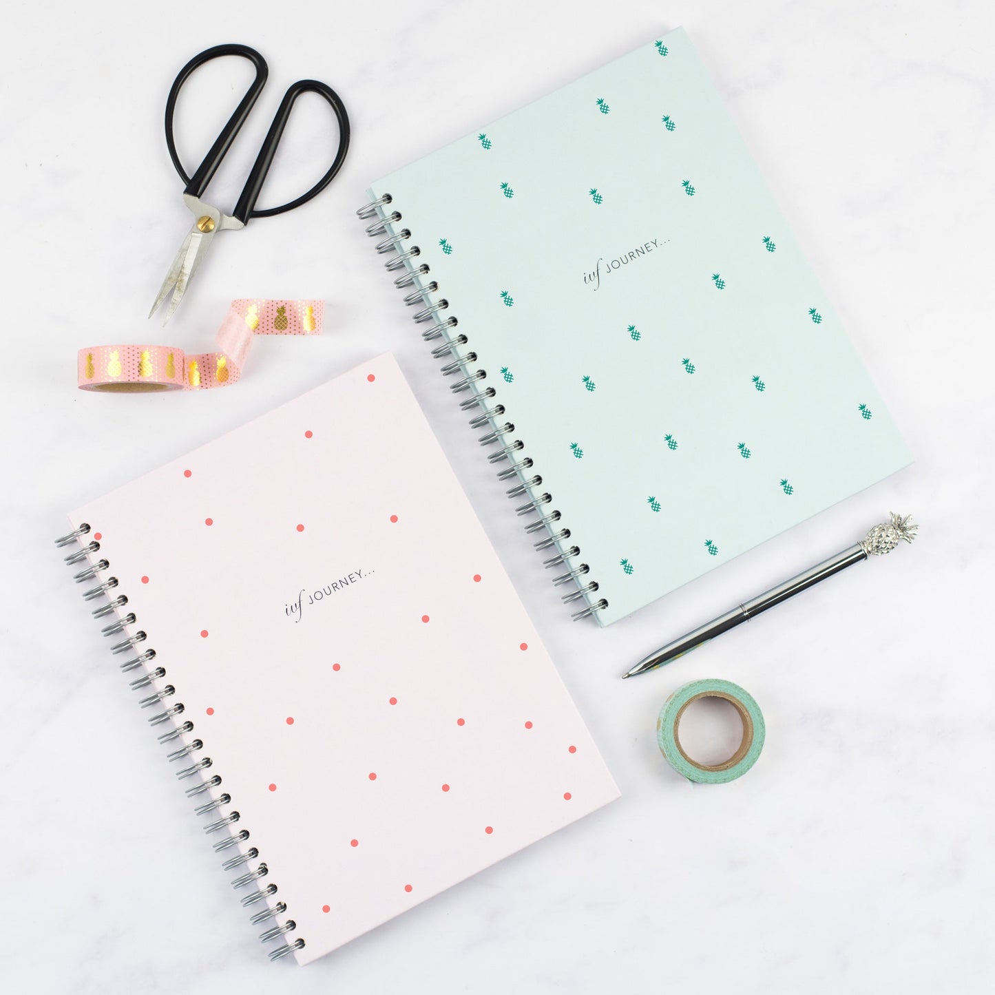 the pink spot ivf journey planner and mint pineapple ivf journey planner by nothing but lovely